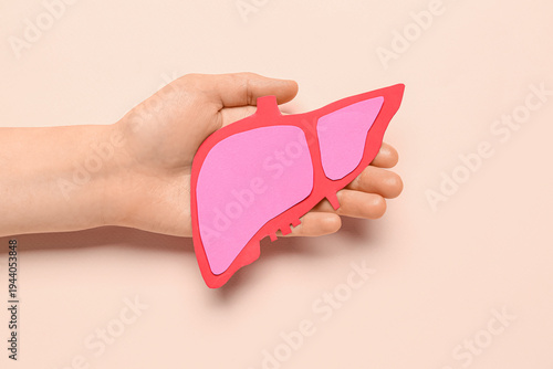 Female hand holding pink pa...