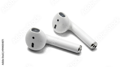 Bild auf Leinwand two white wireless earbuds lying on a black surface, captured in a clean studio shot emphasizing their design and technology