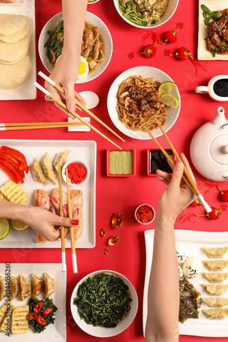 Female hands with chopstick...