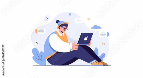 Person in colorful clothing sits on the ground using a laptop