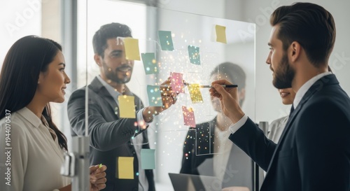 Diversified Business Team Brainstorming with Sticky Notes on Transparent Glass Board in Modern Office