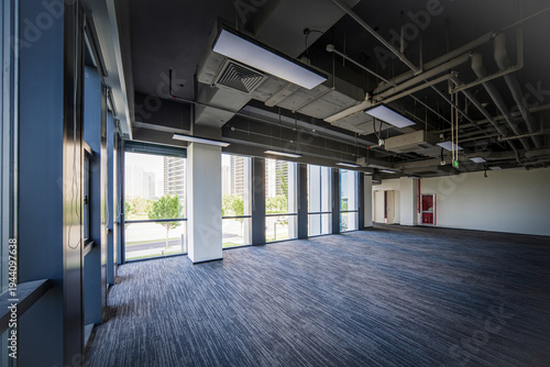 Spacious Modern Office Interior with Abundant Natural Light and Open Layout