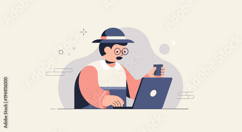 Person in hat and glasses working on laptop, holding a coffee cup