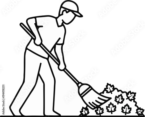 Person with a baseball cap rakes leaves into a pile with a broom