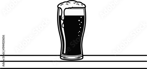 Tall glass filled with dark beverage and frothy head, bubbles inside