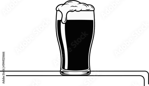 Black liquid with foamy head in a tall glass on a dark surface