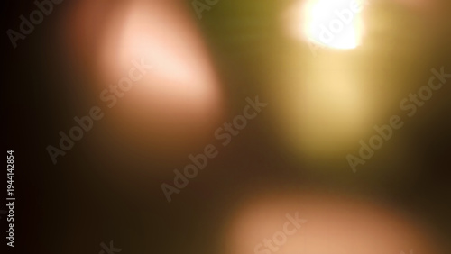 Foto Abstract background featuring soft warm lens flare effects and subtle bokeh ligh