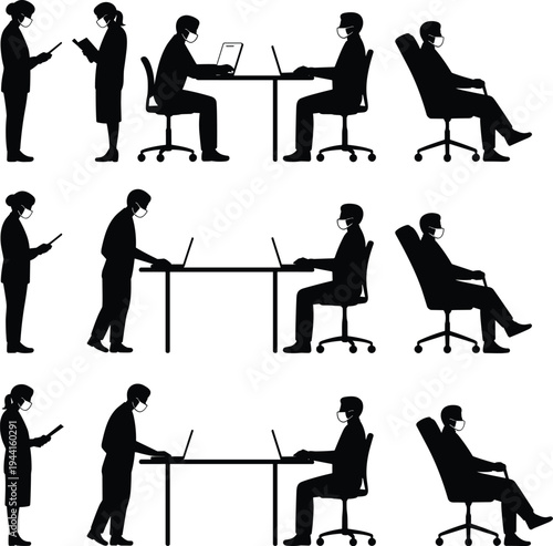 Silhouette office workers wearing protective face masks using laptops and mobile devices in socially distanced workplace during pandemic safety measures