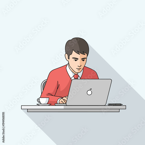 Young Man Working Diligently on Laptop Computer at Desk.