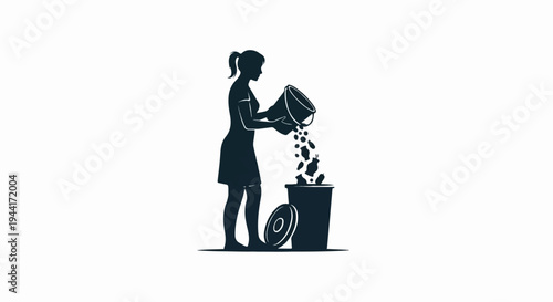 Woman emptying a bucket of debris into a trash bin