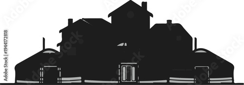 Silhouetted structures a central building with rounded, tent-like dwellings on either side