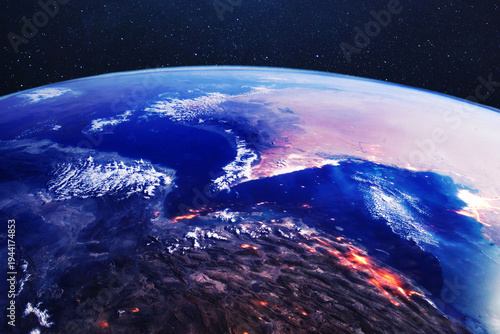 Cinematic satellite view of the Strait of Hormuz and Iran at night, showing glowing city lights and strategic coastlines. Concept of geopolitical tension, energy security, and regional conflict