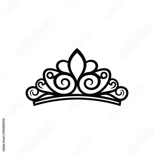 A beautiful tiara sits on a surface in a elegant setting with a crown