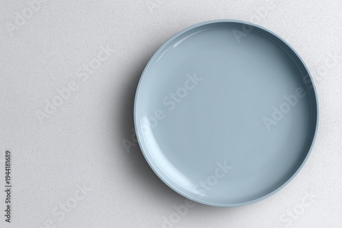 Empty plate on minimal background hunger poverty and food scarcity concept