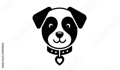 A cute black and white dog with a heart shaped tag on its collar smiling sweetly