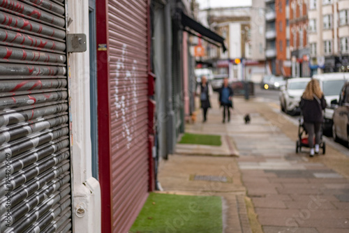 UK- Closed shops. Run down London street with closed shops and defocussed background