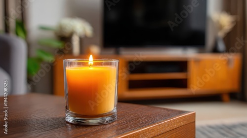 Serenity in a Modern Living Room with a Lit Candle on a Wooden Table, Creating a Cozy Atmosphere with Soft Lighting and Relaxing Vibes