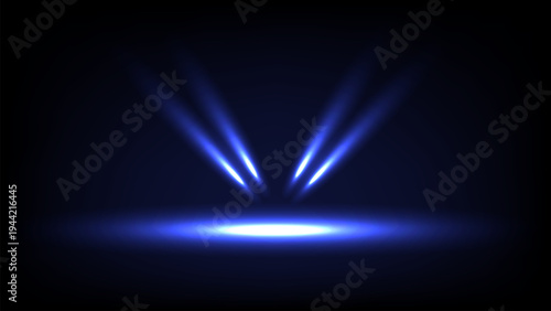 Blue spotlight beams illuminate dark stage, creating dramatic and mysterious atmosphere