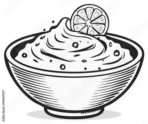 Creamy dip or spread in a bowl topped with a lemon slice and a few dots.
