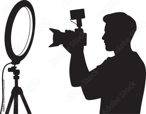 Silhouette of a content creator with camera and ring light setup