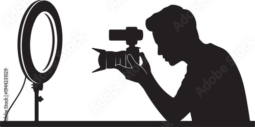 Silhouette of a photographer with a ring light and camera