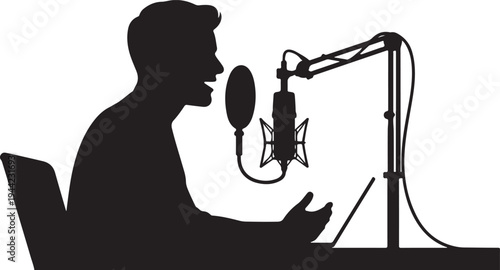 Silhouette of man speaking into a studio microphone