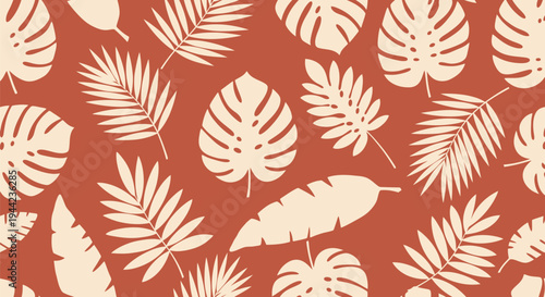 Tropical leaves on orange background.