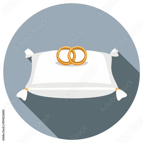 Two gold wedding rings resting on a white satin pillow with tied corners