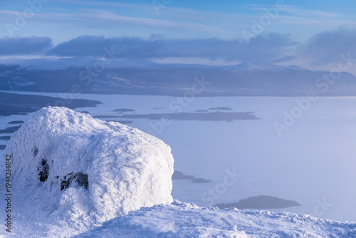 Photos snowbound rock and view of Kandalaksha bay in haze