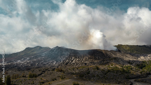 Fotografi Massive white plume rising from Mount Bromo crater, East Java, Indonesia