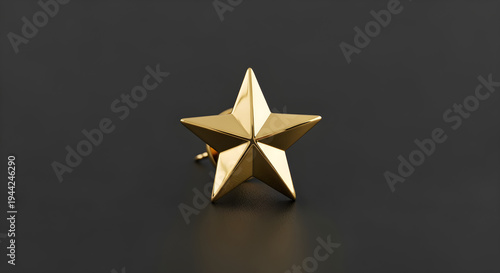 gold star pin on a black background, isolated.