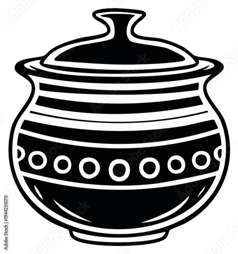 Black and white ceramic container with lid for storing food or cooking in a kitchen