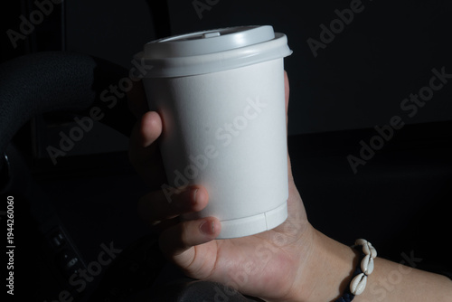 Shadowy Perspective of Holding a Coffee Cup