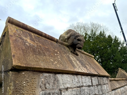 The ornate clock tower of Cardiff Castle stands against a dramatic sky in the capital city of Wales.
