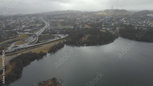 Wallpaper Mural Aerial drone footage showing a suburban area during gloomy midday conditions. The scene features residential houses, streets, and surrounding infrastructure under overcast skies and diffused daylight, Torontodigital.ca