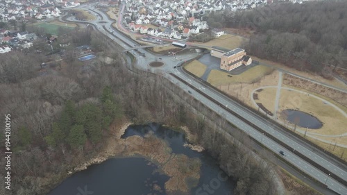 Wallpaper Mural Aerial drone footage showing a suburban area during gloomy midday conditions. The scene features residential houses, streets, and surrounding infrastructure under overcast skies and diffused daylight, Torontodigital.ca