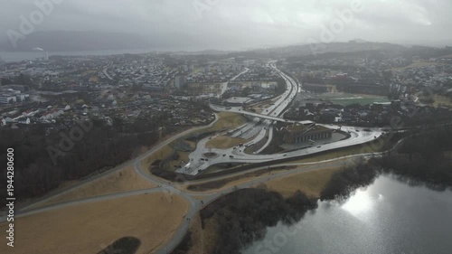 Wallpaper Mural Aerial drone footage showing a suburban area during gloomy midday conditions. The scene features residential houses, streets, and surrounding infrastructure under overcast skies and diffused daylight, Torontodigital.ca