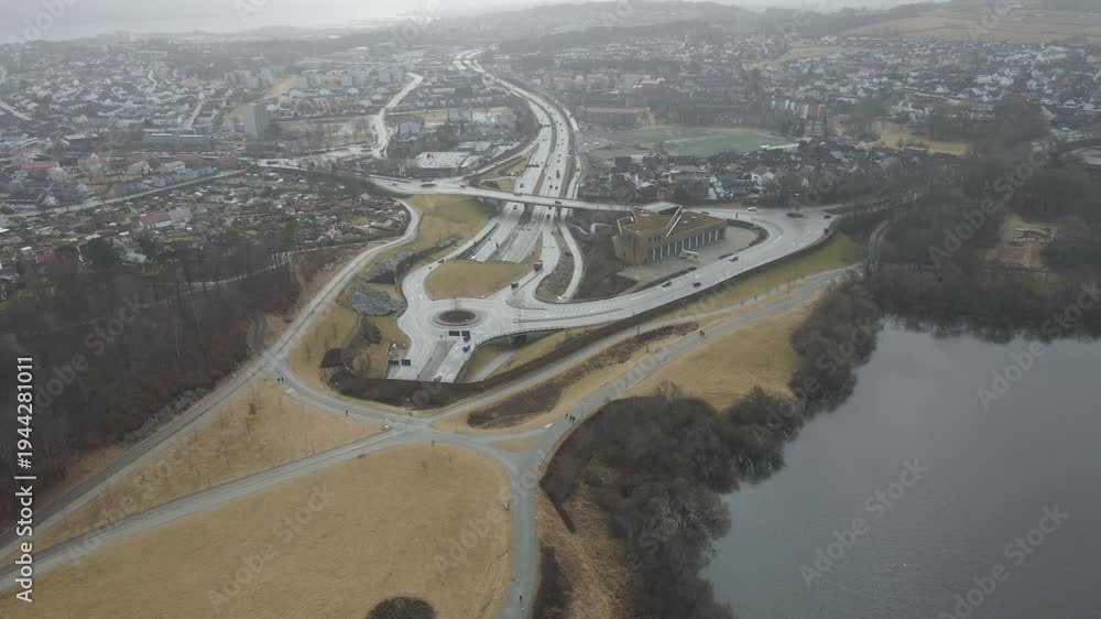 custom made wallpaper toronto digitalAerial drone footage showing a suburban area during gloomy midday conditions. The scene features residential houses, streets, and surrounding infrastructure under overcast skies and diffused daylight,