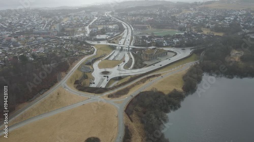 Wallpaper Mural Aerial drone footage showing a suburban area during gloomy midday conditions. The scene features residential houses, streets, and surrounding infrastructure under overcast skies and diffused daylight, Torontodigital.ca