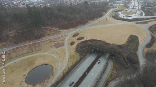 Wallpaper Mural Aerial drone footage showing a suburban area during gloomy midday conditions. The scene features residential houses, streets, and surrounding infrastructure under overcast skies and diffused daylight, Torontodigital.ca