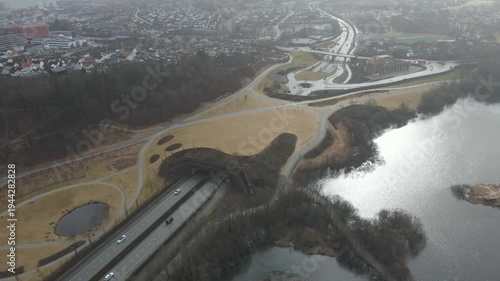 Wallpaper Mural Aerial drone footage showing a suburban area during gloomy midday conditions. The scene features residential houses, streets, and surrounding infrastructure under overcast skies and diffused daylight, Torontodigital.ca