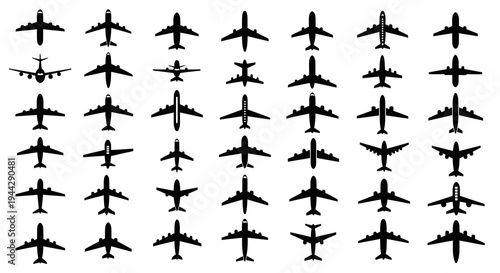 Set of diverse black airplane silhouettes on white background
