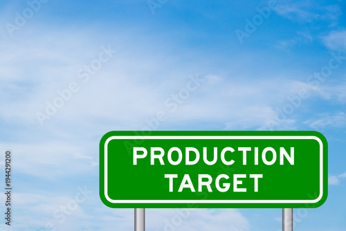 Green color transportation sign with word production target on blue sky with white cloud background