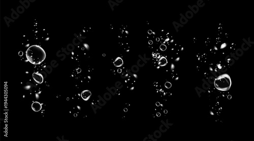 Realistic oxygen bubbles in water on a black background with fizzy sparkles and effervescent style. 