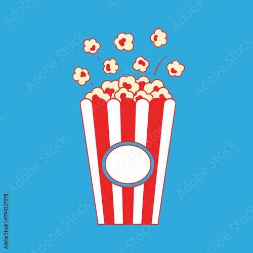 Popcorn Bucket Overflowing with Popcorn and Some Pieces Flying Out