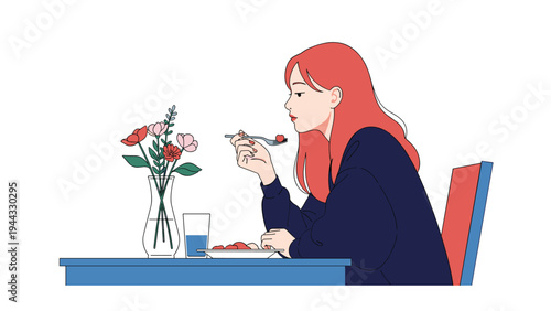 Young woman with long red hair sitting at a table and enjoying a meal with fresh flowers and a glass of water in a minimalist setting.