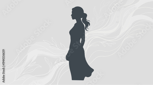 Elegant silhouette of a woman in a flowing dress, side view.