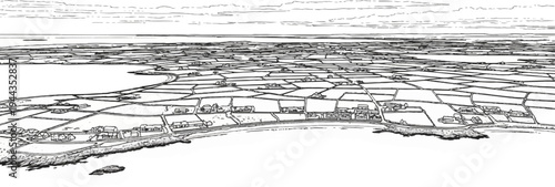 Aerial view of a coastline with cultivated fields and scattered buildings