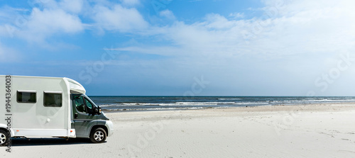 Camper on a beach by the sea