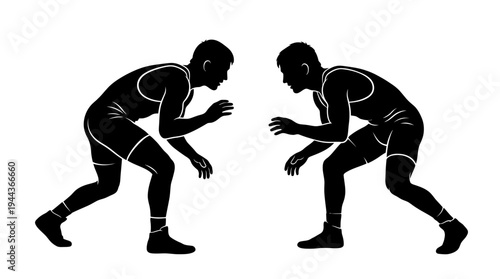 Silhouetted wrestlers in a stance, ready to compete in a grappling match, highlighting the sport of wrestling